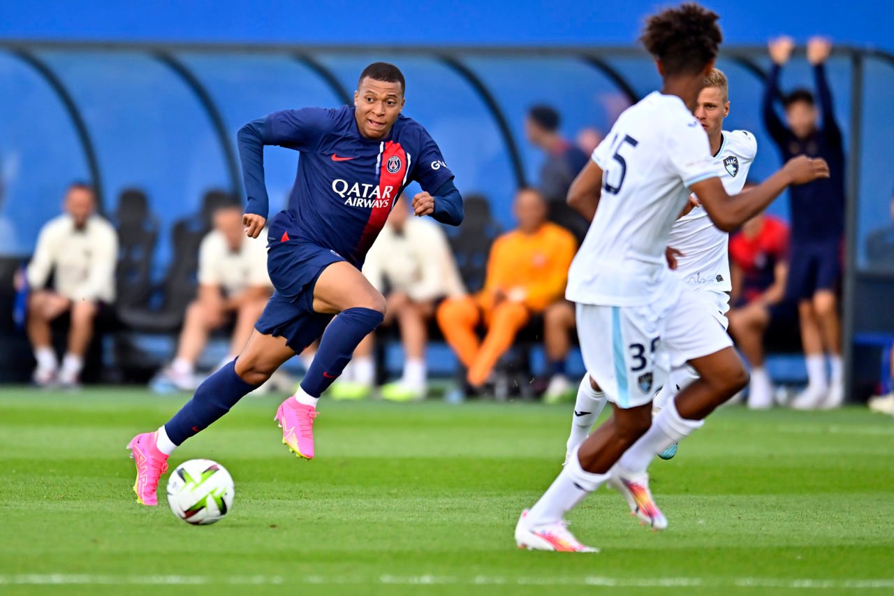 Kylian Mbappe runs with the ball