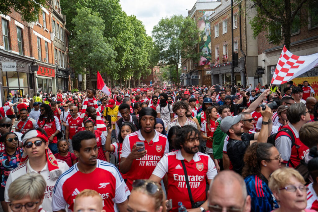 Arsenal fans celebrate on the streets after the Football