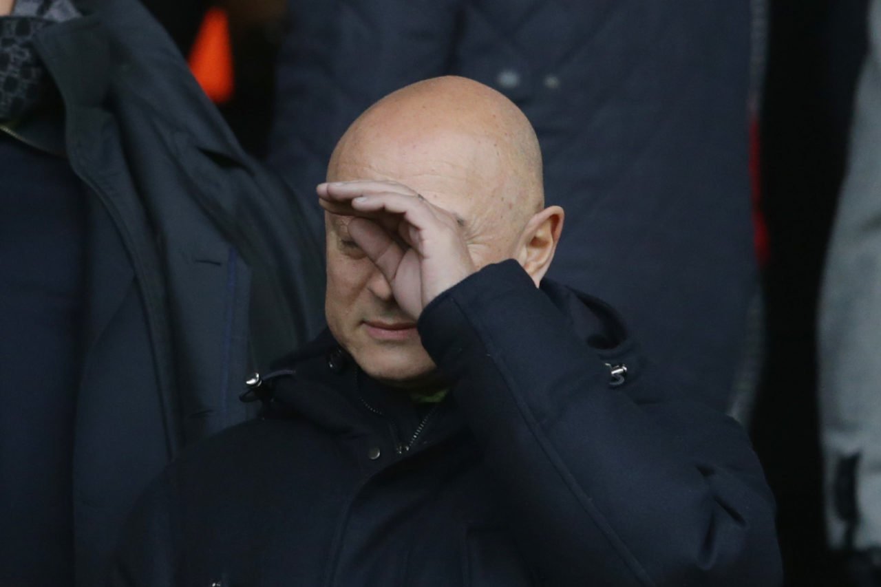 Spurs chairman Daniel Levy with his hand on his face
