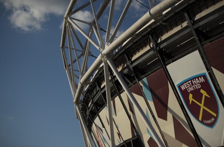 Exterior view of the London Stadium with West Ham United club badge