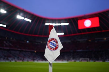 A flag with the Bayern Munich badge at the Allianz Arena